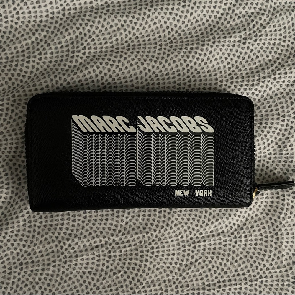 Black Marc Jacobs wallet. Fun logo on front of wallet